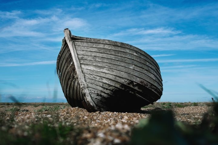 shallow focus photography of boat on coast